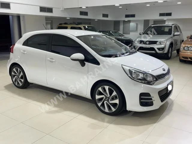 Kia  Rio  2016  Hatchback  Automatic  4  87,800  FWD  White  Gasoline