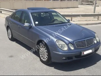 Mercedes-Benz  E-Class  240  2005  Sedan  Automatic  6  71,300  RWD  Blue  Gasoline