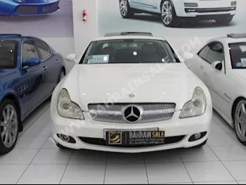 Mercedes-Benz  CLS-Class  500 AMG  2006  Sedan  Automatic  8  138,000  RWD  White  Gasoline