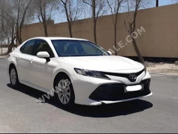 Toyota  Camry  LE  2019  Sedan  Automatic  4  95,100  FWD  White  Gasoline