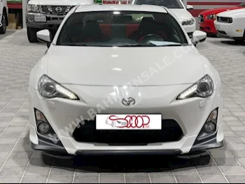 Toyota  86  2016  Coupe / Sport  Automatic  4  77,000  FWD  White  Gasoline