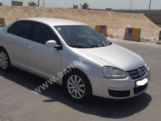 Volkswagen  Jetta  2010  Sedan  Automatic  4  93,900  FWD  Silver  Gasoline