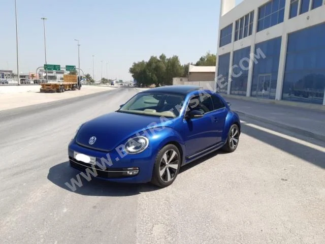 Volkswagen  Beetle  2015  Hatchback  Automatic  4  63,100  FWD  Blue  Gasoline