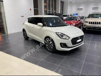 Suzuki  Swift  2019  Hatchback  Automatic  4  9,000  FWD  White  Gasoline