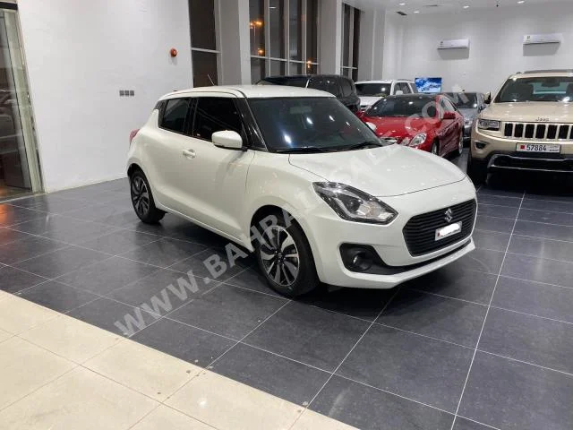 Suzuki  Swift  2019  Hatchback  Automatic  4  9,000  FWD  White  Gasoline