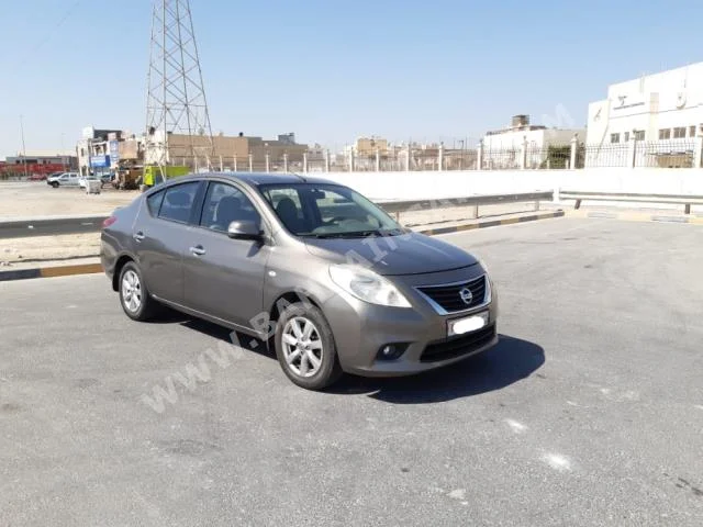 Nissan  Sunny  2013  Sedan  Automatic  4  129,600  FWD  Gray  Gasoline