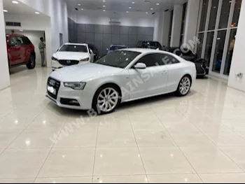 Audi  A5  2.0 T  2013  Coupe / Sport  Automatic  4  174,450  FWD  White  Gasoline
