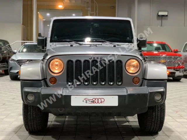 Jeep  Wrangler  Sahara  2013  SUV  Automatic  6  186,000  4WD  Silver  Gasoline