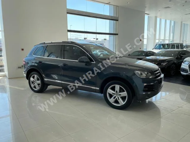 Volkswagen  Touareg  2015  SUV  Automatic  6  118,000  AWD  Gray  Gasoline