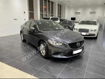 Mazda  Mazda 6  2018  Sedan  Automatic  4  82,500  FWD  Gray  Gasoline