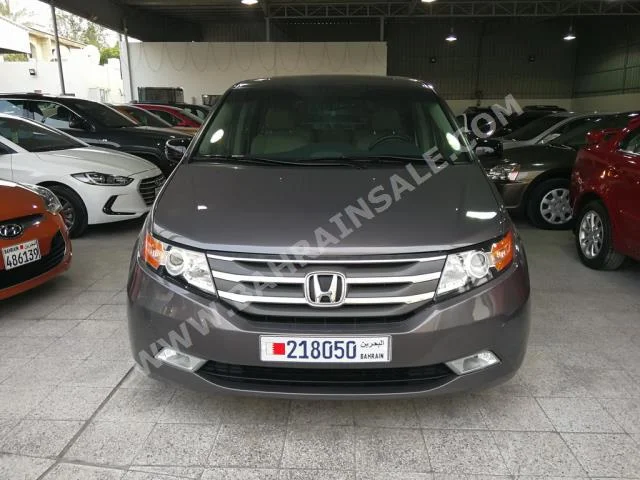 Honda  Odyssey  Touring  2012  Van / Bus  Automatic  6  98,000  FWD  Brown  Gasoline
