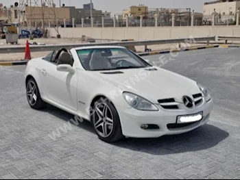 مرسيدس - بنز  اس ال كيه - كلاس  200  2005  كشف  اتوماتك  4  150,200  دفع خلفي  أبيض  بنزين