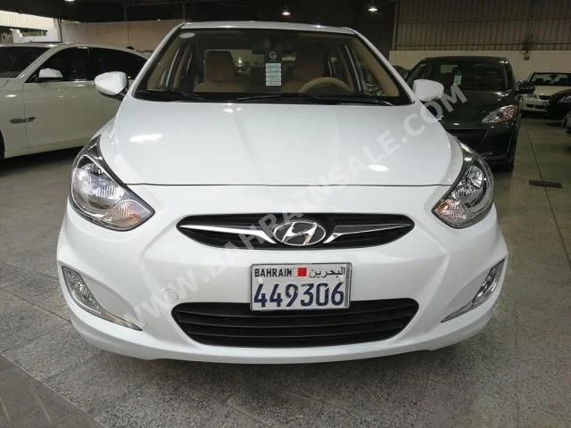 Hyundai  Accent  2013  Sedan  Automatic  4  58,000  FWD  White  Gasoline
