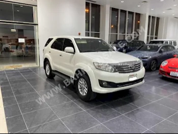 Toyota  Fortuner  2014  SUV  Automatic  4  156,900  FWD  Pearl  Gasoline