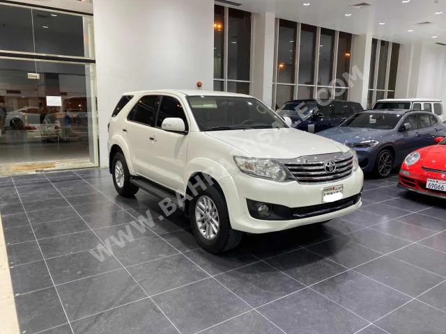 Toyota  Fortuner  2014  SUV  Automatic  4  156,900  FWD  Pearl  Gasoline