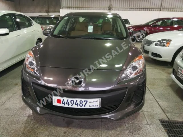 Mazda  Mazda 3  2013  Sedan  Automatic  4  82,000  FWD  Gray  Gasoline