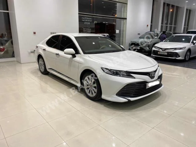 Toyota  Camry  LE  2019  Sedan  Automatic  4  49,450  FWD  White  Gasoline