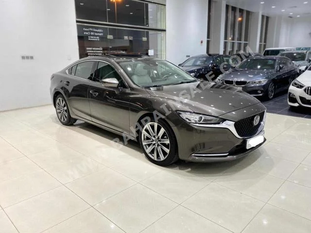 Mazda  Mazda 6  2019  Sedan  Automatic  4  42,700  FWD  Brown  Gasoline
