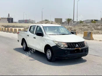 Mitsubishi  L 200  2016  Pick Up  Manual  4  140,800  RWD  White  Gasoline