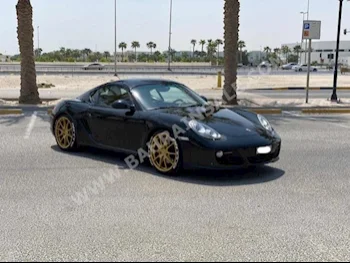 Porsche  Cayman  2011  Coupe / Sport  Automatic  6  80,850  RWD  Black  Gasoline