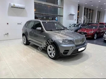 BMW  X-Series  5  2012  SUV  Automatic  8  129,700  AWD  Gray  Gasoline