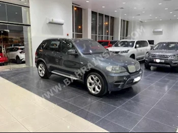 BMW  X-Series  5  2011  SUV  Automatic  8  93,250  AWD  Gray  Gasoline